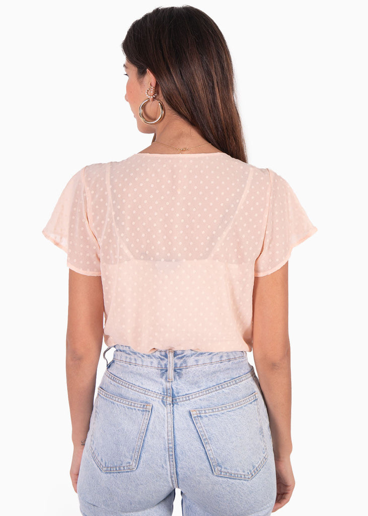 Body con escote cruzado en tela transparente color rosado para mujer - Flashy