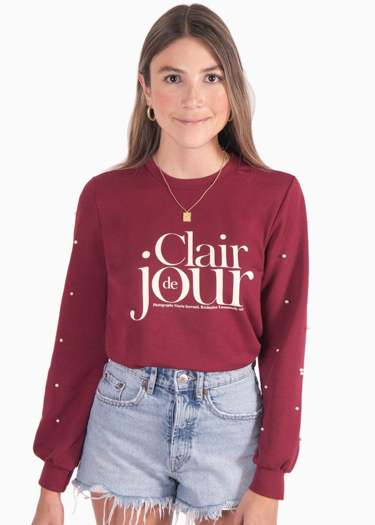 Buzo con estampado "Clair de jour" y perlas en mangas color vino para mujer - Flashy