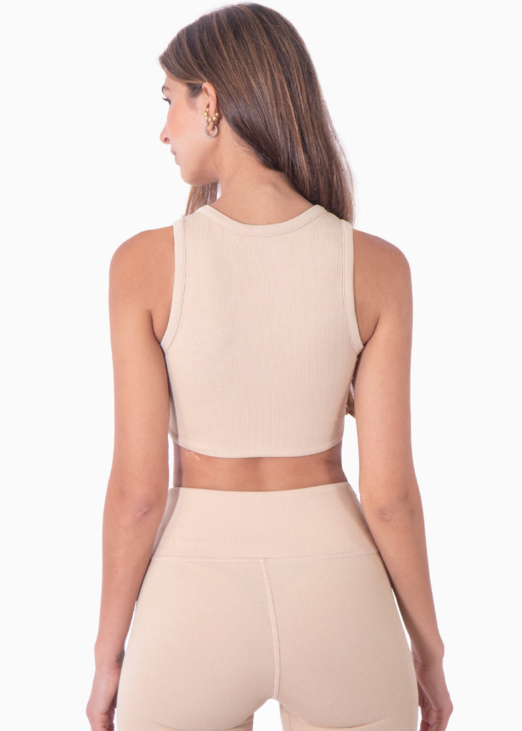 Top deportivo cuello alto sin mangas color beige para mujer - Flashy